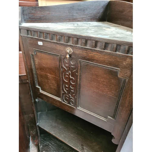 530 - An early 20th century oak freestanding corner bureau cabinet with fall front, internal storage and t... 