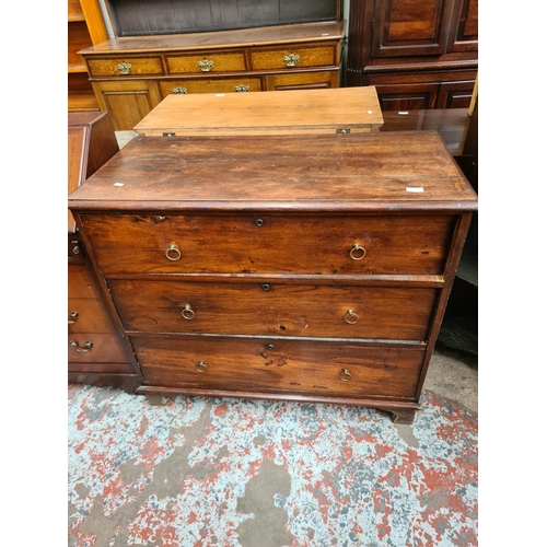 531 - A Georgian oak chest of three drawers - measuring approx. 90cm high, 104cm wide and 50cm deep (see c... 