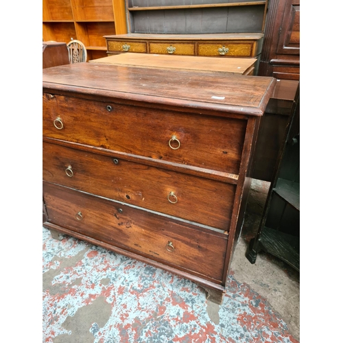 531 - A Georgian oak chest of three drawers - measuring approx. 90cm high, 104cm wide and 50cm deep (see c... 