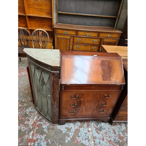 532 - A Georgian style inlaid mahogany effect bureau with fall front and three lower drawers and a mahogan... 