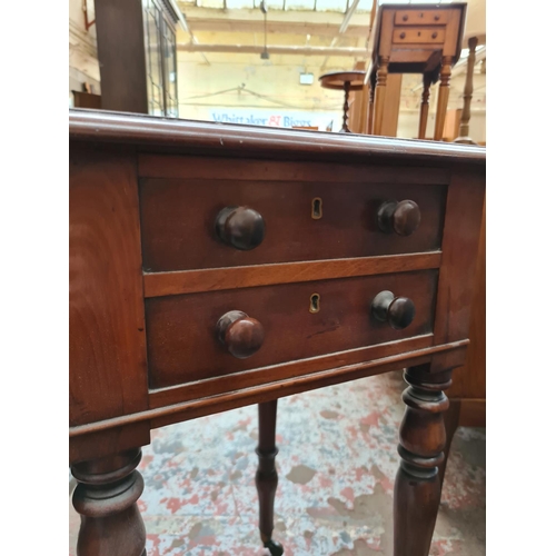 537 - A 19th century mahogany drop leaf work table with two drawers and two frieze drawers on brass castor... 