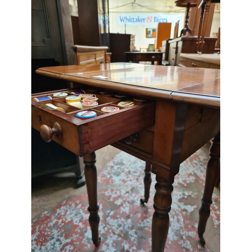 537 - A 19th century mahogany drop leaf work table with two drawers and two frieze drawers on brass castor... 