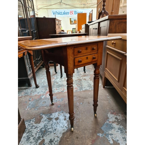 538 - A 19th century mahogany drop leaf work table with two drawers and two frieze drawers on ceramic cast... 