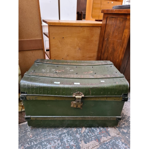 542 - A vintage green painted metal travel trunk - measuring approx. 74cm wide, 51cm deep and 44cm high