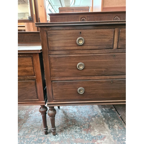 544 - An Edwardian carved mahogany two piece bedroom suite on reeded supports comprising dressing table wi... 