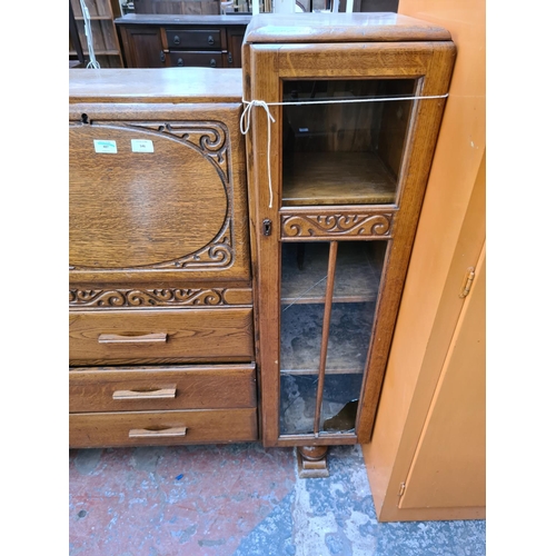 546 - An Art Deco oak side by side bureau bookcase with three central drawers, fall front and two glazed d... 