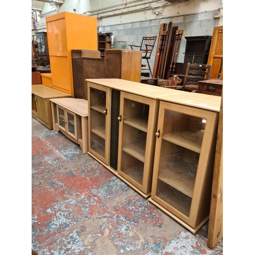 548 - Three items to include a modern oak effect two door media cabinet with central CD rack, a matching s... 