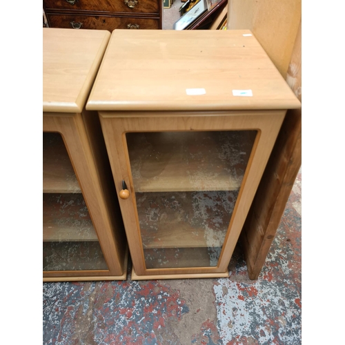 548 - Three items to include a modern oak effect two door media cabinet with central CD rack, a matching s... 