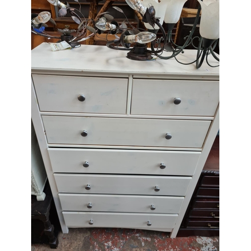 559 - Five items to include a white painted chest of two short over five long drawers, Lloyd Loom style gr... 