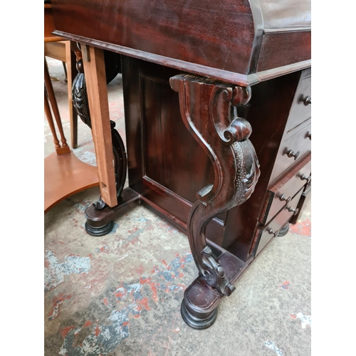 562 - A Victorian style mahogany davenport desk with red leather writing surface and four lower drawers (s... 