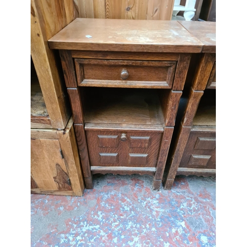 567 - A pair of oak bedside cabinets - measuring approx. 76cm high, 44cm wide and 38cm deep