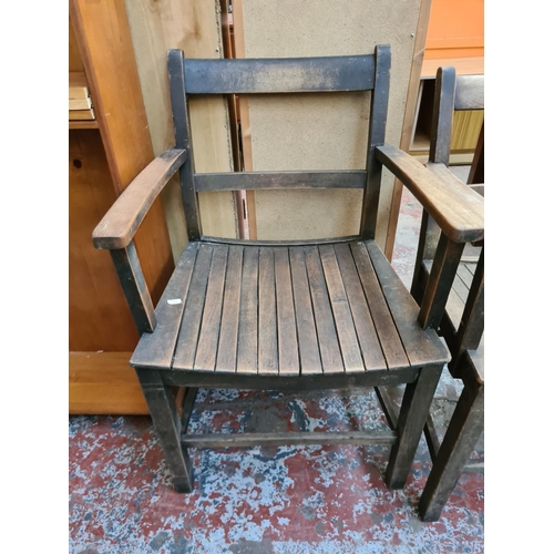 574 - A pair of vintage oak carver dining chairs with slatted seats.