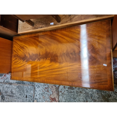 576 - A pine wall mountable corner cabinet and a mahogany effect rectangular coffee table