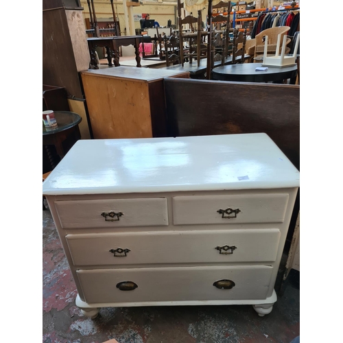 585 - An Edwardian white painted chest of two short over two long drawers - 81cm high, 96cm wide and 48cm ... 