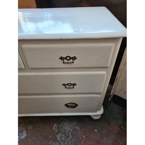 585 - An Edwardian white painted chest of two short over two long drawers - 81cm high, 96cm wide and 48cm ... 