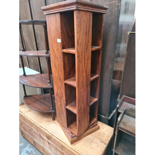 588 - An Indian sheesham wood revolving CD rack - measuring approx. 112cm high