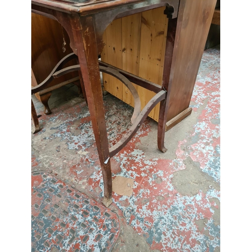 598 - An Edwardian mahogany concealed writing desk - measuring approx. 80cm high, 68cm wide and 44cm deep ... 