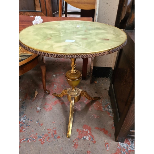 609 - Two items to include an antique style brass and onyx effect tripod wine table with circular top and ... 