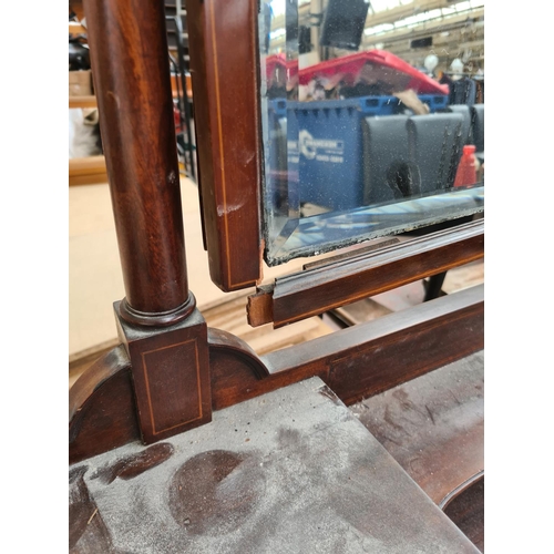 611 - An Edwardian inlaid mahogany dressing table with upper bevel edged mirror - measuring approx. 100cm ... 