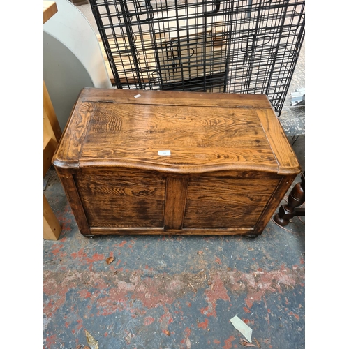 614 - An oak blanket box - measuring approx. 50cm high, 77cm wide and 44cm deep