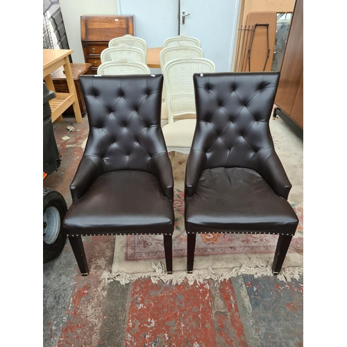 617 - A pair of brown leatherette metal studded dining chairs with chrome hoop backs