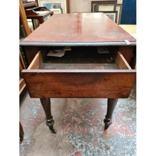 632 - A 19th century mahogany drop leaf occasional table