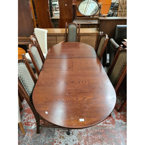 638 - A Parker Knoll oak extending dining table with six dining chairs (see condition report)