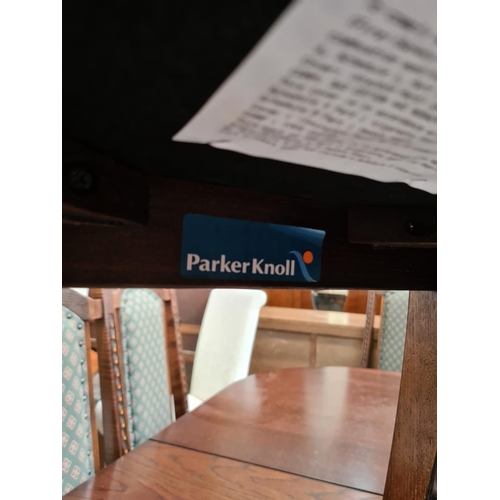 638 - A Parker Knoll oak extending dining table with six dining chairs (see condition report)