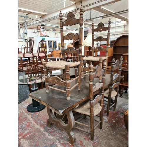 642 - An 18th century style oak plank top refectory dining table and six matching ladder back dining chair... 