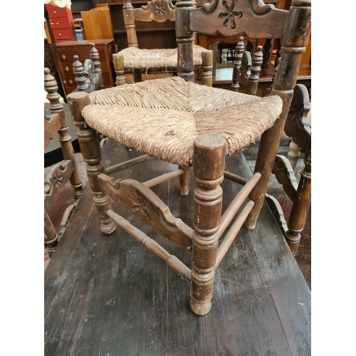 642 - An 18th century style oak plank top refectory dining table and six matching ladder back dining chair... 