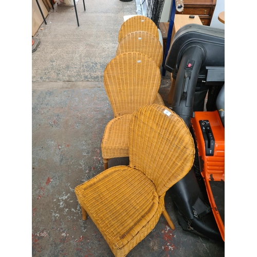 647 - Four wicker and cane dining chairs