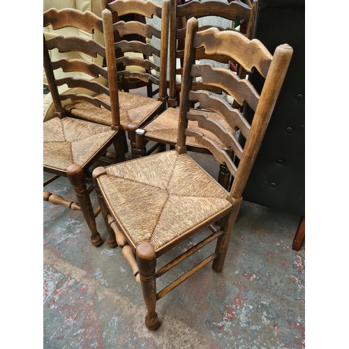 649 - Four elm ladder back farmhouse dining chairs with rush seats