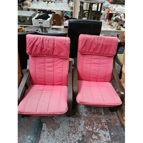 655 - A pair of Ikea Poang armchairs with red upholstery