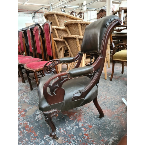 659 - A Victorian carved mahogany parlour chair with fretwork back and green leather upholstery - measurin... 