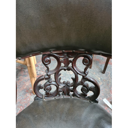 659 - A Victorian carved mahogany parlour chair with fretwork back and green leather upholstery - measurin... 