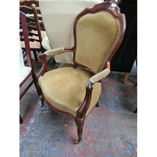 661 - A Victorian mahogany parlour chair with green upholstery - measuring approx. 99cm high, 62cm wide an... 