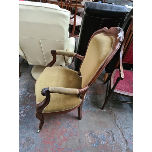 661 - A Victorian mahogany parlour chair with green upholstery - measuring approx. 99cm high, 62cm wide an... 