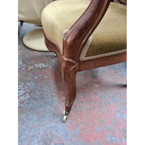 661 - A Victorian mahogany parlour chair with green upholstery - measuring approx. 99cm high, 62cm wide an... 