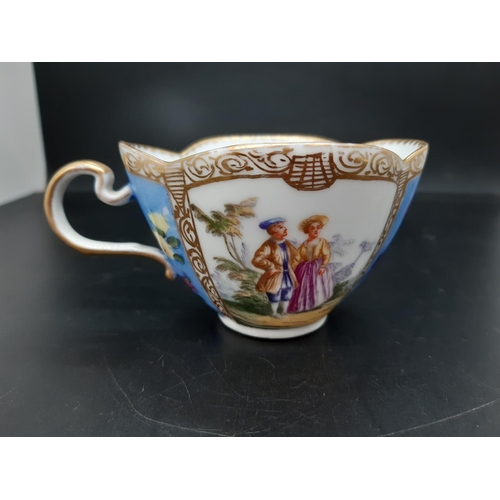 20 - A Meissen porcelain hand painted cup and saucer with figures in classical garden scene and floral pa... 