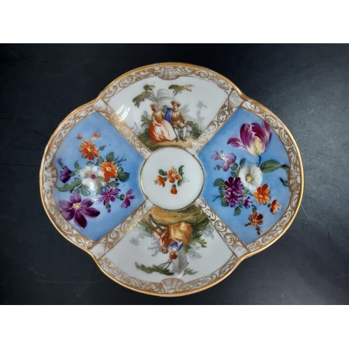 20 - A Meissen porcelain hand painted cup and saucer with figures in classical garden scene and floral pa... 