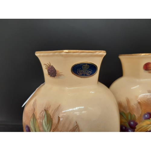 26 - A pair of Aynsley Orchard Gold hexagonal vases originally painted by D.Jones - measuring approx. 13c... 