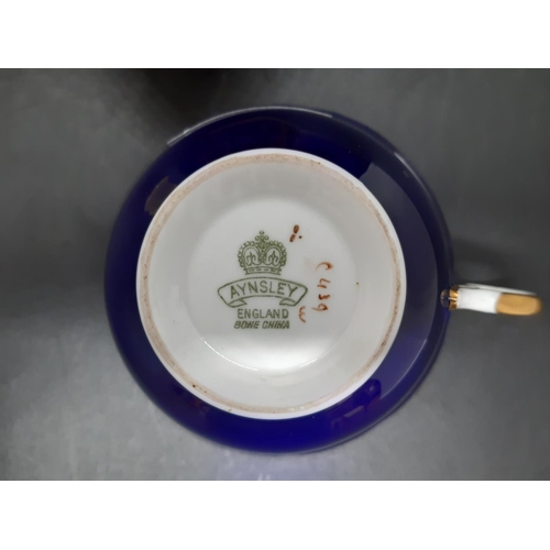 32 - Three pieces of Aynsley Orchard Gold china to include a Windsor spill vase (12cm), tea cup and a hex... 