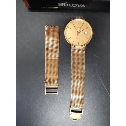 61 - A Bulova hallmarked 9ct gold mens wristwatch - approx. gross weight with movement and loose strap co... 