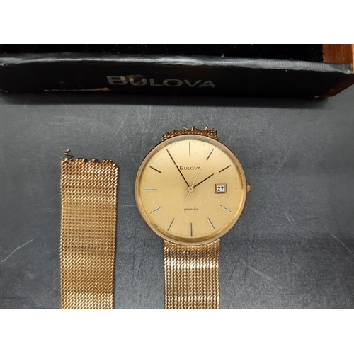 61 - A Bulova hallmarked 9ct gold mens wristwatch - approx. gross weight with movement and loose strap co... 