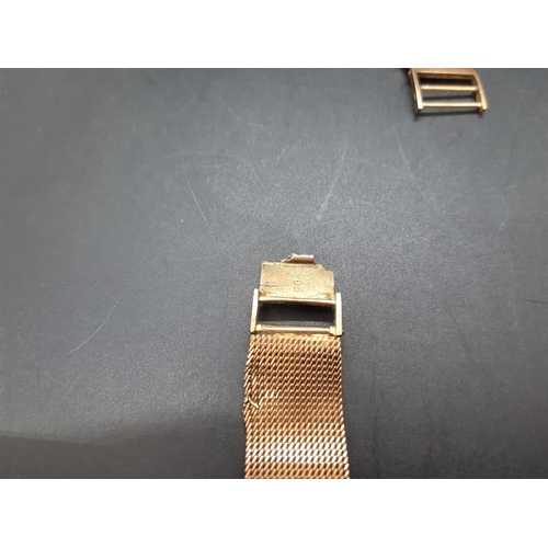 61 - A Bulova hallmarked 9ct gold mens wristwatch - approx. gross weight with movement and loose strap co... 