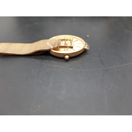 61 - A Bulova hallmarked 9ct gold mens wristwatch - approx. gross weight with movement and loose strap co... 