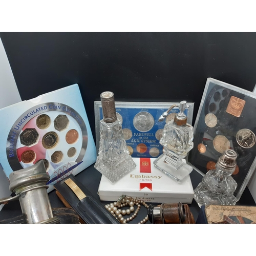 67 - A box containing various collectables and curios to include cut glass atomizers, cut glass perfume b... 