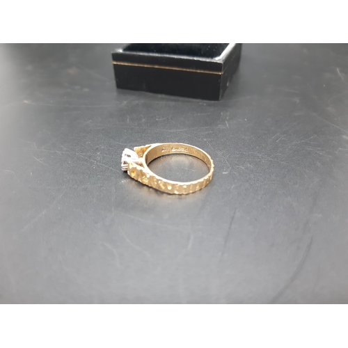 106 - A hallmarked 18ct gold solitaire diamond ring with sculptured band - approx. total weight 3 grams an... 