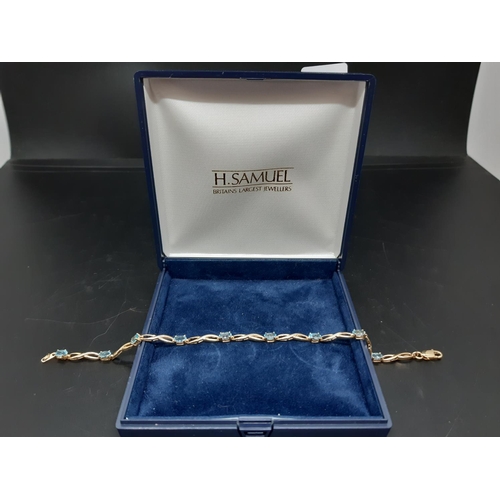 110 - A hallmarked 9ct gold bracelet with inset topaz stones - approx. total weight 4.4 grams