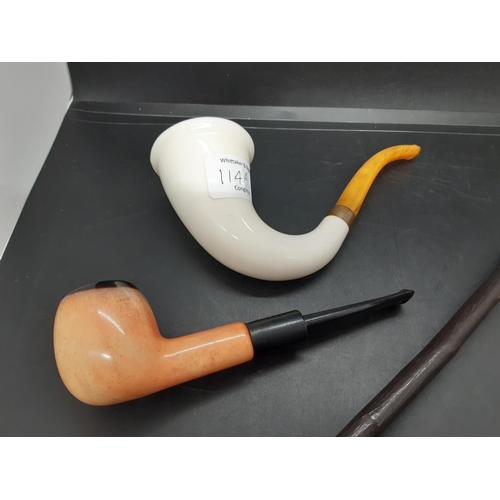 114A - A collection of four smoking pipes to include a French Ropp desk pipe, Zenith of Holland clay pipe e... 